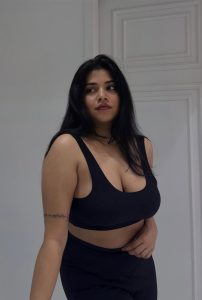 Yamini Hot Escort posing confidently in stylish black outfit with bold and glamorous look