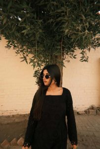 Tanisha Independent Escorts posing elegantly in black outfit outdoors in Siliguri