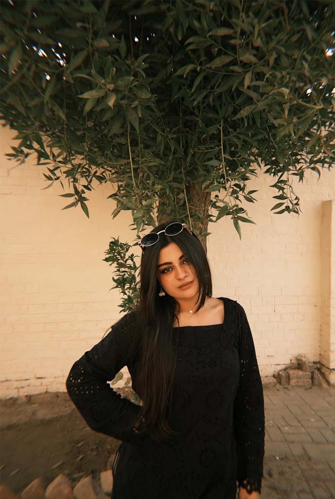 Tanisha Independent Escorts confident outdoor look with sunglasses and black dress