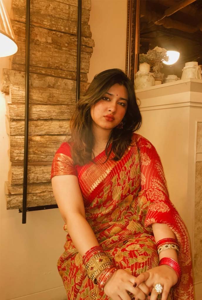 Oindrila Independent Escorts showcasing classy saree look with graceful charm indoors