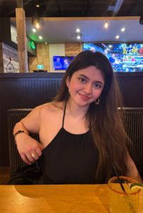 Tiya Celebrity Escort smiling confidently during an elegant evening outing in Siliguri