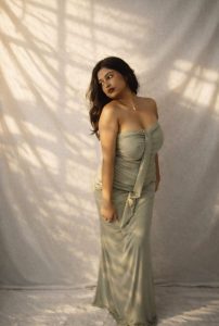 Aarohi Sexy Escort in elegant green bodycon gown posing gracefully in soft studio lighting