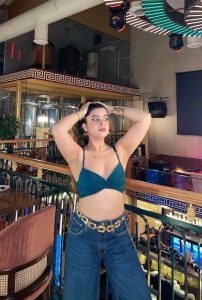 Anwesha Celebrity Escorts posing confidently in a stylish outfit at a luxury lounge in Siliguri